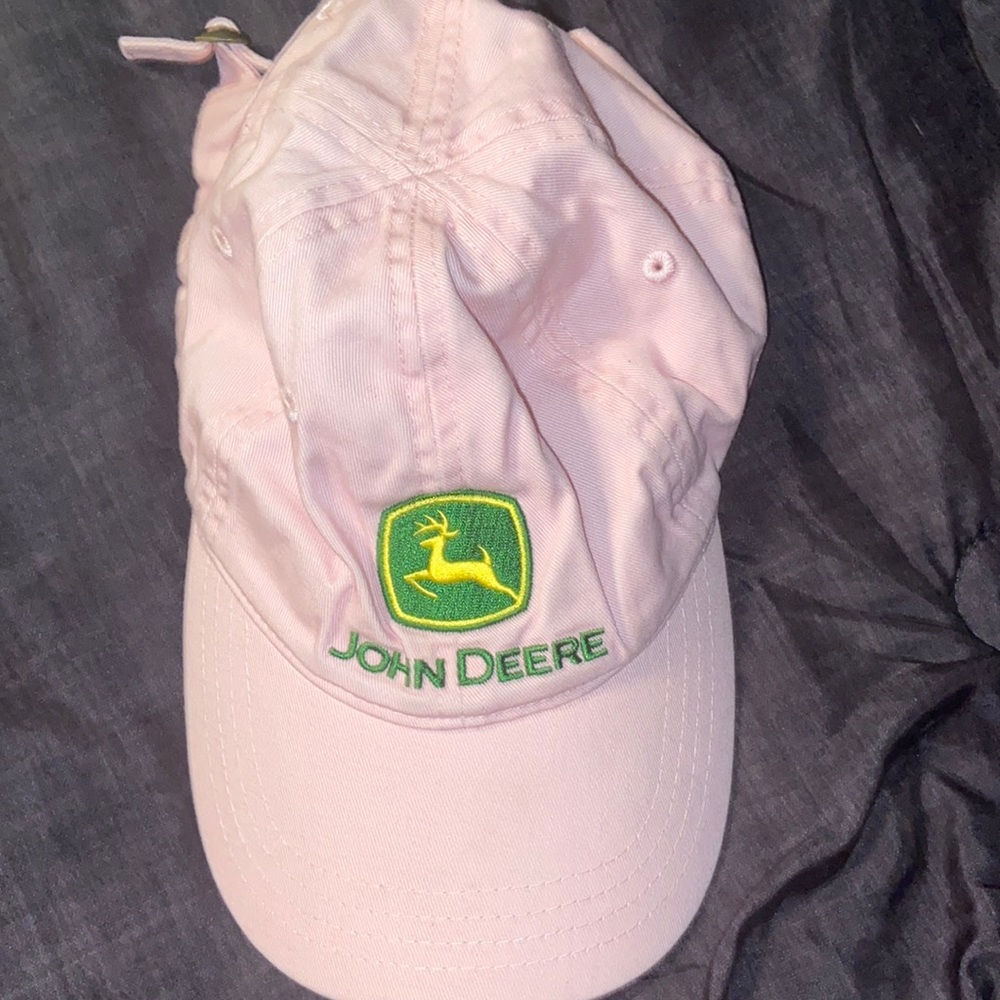Pink John Deere hat with adjustable strap.